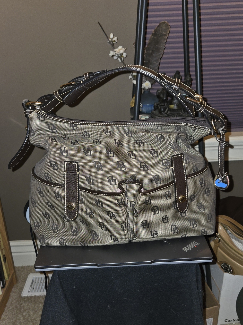 Elevate your style with this classic Dooney & Bourke Double Pocket Hobo Bag!
